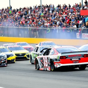 Motorsport race at Bristol Motor Speedway with cars and crowd