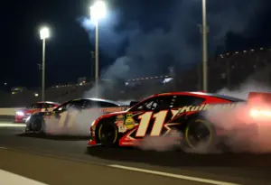 Racing cars competing at Bristol Motor Speedway during the night race.