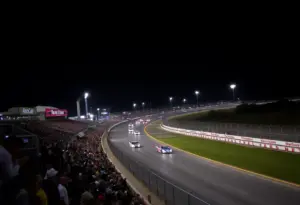 Cars racing under the lights at Bristol Motor Speedway
