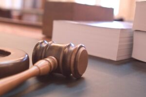 Judge's gavel on a wooden desk